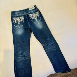 Worn twice, excellent condition. Beautiful back pocket design.